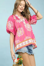 Umgee floral border smocked v-neck boho blouse in vibrant pink with white and yellow floral patterns and puffed sleeves