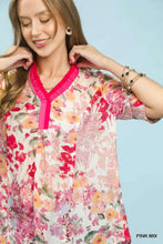 Umgee floral contrast pleat neck top with vibrant pink v-neck collar and pastel floral print on light fabric