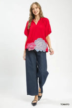 Red short-sleeved Umgee blouse with pink and white floral embroidered hem design ideal for casual wear