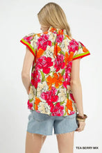 Umgee floral print blouse with contrast trim featuring bold pink and orange roses on off-white with ruffled sleeves