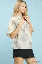 Beige umgee floral print v neck blouse with black embroidery and short flutter sleeves for casual wear