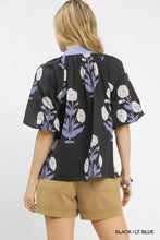 Black umgee floral print blouse with white and lavender flowers short puffed sleeves and light blue collar