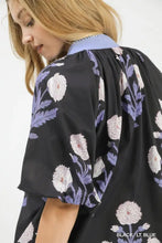 Black umgee floral print top with delicate white and light blue floral pattern, puffed sleeves, and light blue collar