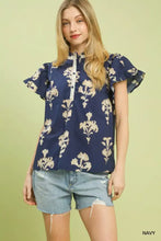 Navy blue umgee floral ruffle sleeve split neck blouse with cream floral embroidery and ruffled short sleeves
