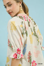 Umgee floral split neck puff sleeve top in cream cotton with pink yellow and green floral pattern on soft fabric