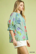 Umgee floral split neck puff sleeve top in light seafoam green with red purple and blue floral pattern