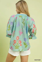 Umgee floral split neck puff sleeve top in light seafoam green with pink red purple floral pattern and ruffled cuffs