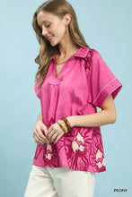 Umgee floral short sleeve pink peony-patterned blouse with v-neckline and delicate white stitching floral split-neck short top