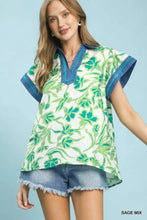 Umgee floral split neck top in sage mix with white base, green floral pattern, and navy blue collar and sleeve trim