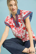 Umgee floral split neck top featuring a vibrant red and white floral print blouse with navy collar and sleeve trim