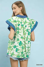 Womens white floral split neck blouse with green sage and teal pattern blue trim and frayed denim hem by umgee