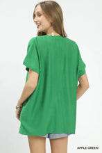 Apple green umgee flowy v neck short sleeve blouse with loose fit and subtle vertical seam detail