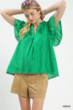 Vibrant green lightweight umgee flutter sleeve relaxed top with pom-pom trim and flutter sleeve detail