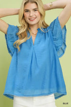 Blue umgee flutter sleeve relaxed top with pom-pom trim and flutter sleeve detail in lightweight fabric