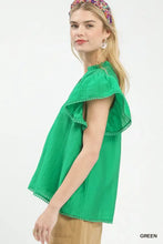 Vibrant green umgee flutter sleeve relaxed blouse with ruffled design and delicate pom-pom trim on sleeves and hem