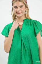 Umgee flutter sleeve relaxed top in vibrant green textured cotton with ruffled sleeves and gathered neckline trim detail