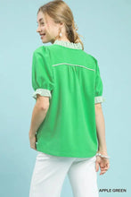 Apple green short-sleeved blouse with striped pattern featuring ruffle trim and french terry fabric puff sleeves