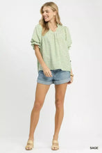 Umgee gingham puff sleeve babydoll blouse in light green and white pattern with ruffled sleeves made from lightweight fabric