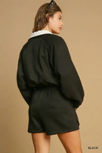 Black Umgee half zip romper with white collar and drawstring waist