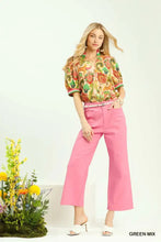 Pink high-waisted cropped trousers with front pockets paired with a paisley print umgee jacquard abstract top