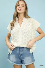 Off-white umgee lace button-front top with short sleeves and subtle floral pattern made of delicate lace fabric