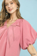 Light pink umgee lace inset puff sleeve boho blouse with delicate lace detailing along the neckline