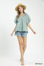 Mint blue umgee lace inset boho blouse with short puff sleeves and ruffled neckline in lightweight fabric