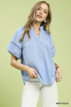 Misty blue umgee lace trim peasant top with short sleeves and delicate lace trim along collar and cuffs