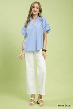 Misty blue short-sleeved umgee lace trim peasant top with delicate eyelet lace trim along sleeves and neckline
