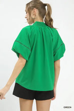 Vibrant green Umgee lace trim peasant top featuring short puffed sleeves and delicate black lace trim along armholes