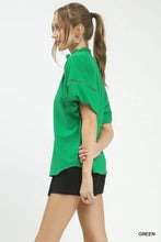 Umgee lace trim peasant top in vibrant green with delicate lace trim on shoulders and short sleeves