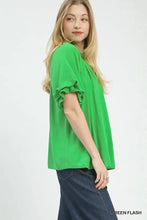 Bright green umgee linen v neck blouse with flutter sleeve and ruffled cuffs in a relaxed fit