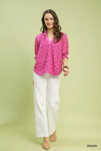 Fuchsia Umgee linen v-neck blouse featuring lace puff sleeve design with three-quarter sleeves for stylish wear
