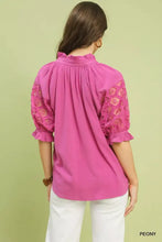 Umgee linen v-neck lace puff sleeve top in vibrant pink with lace puff sleeves, floral patterns, and ruffled cuffs