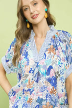 Umgee mix boho printed short-sleeved blouse with colorful blue pink and green botanical print on light background