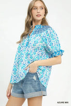 Blue and white patterned Umgee mix boho puff blouse with ruffled puff sleeve smocked design for stylish wear