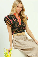 Umgee mix floral print blouse in black with vibrant orange contrast trim and v-neckline for stylish wear