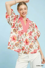 Umgee mix floral print blouse with coral v-neck collar and puff sleeves on an off-white floral print fabric