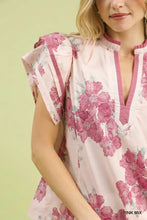 Pink umgee mix floral ruffle sleeve blouse with v-neckline and ruffled cap sleeves in lightweight fabric