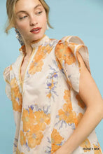 Women’s off-white umgee mix floral ruffle blouse with orange and purple pattern featuring ruffle sleeves and neckline
