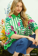 Green and white striped umgee mix floral stripe blouse with pink flamingo and palm tree prints and three-quarter sleeves
