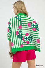 A vibrant green and white striped mix floral button down top with pink floral embroidery and scalloped hemline