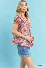 Umgee mix paisley ruffle top featuring pink fabric with ruffled short sleeves and a flared hem