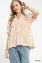 Umgee mix print boho blouse in soft pink and yellow stripes with floral pattern, flutter sleeves, and v-neckline