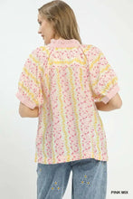 Umgee mix print boho blouse featuring pink and yellow floral pattern, puffed sleeves, and a ruffled collar with contrast trim