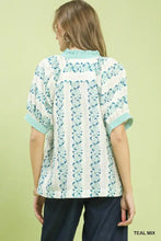 Teal and white mix print boho blouse with vertical stripes floral patterns and ruffled cuffs by umgee