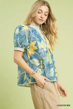 Umgee mixed abstract puff sleeve blouse with blue and yellow floral print, high collar, short sleeves, and pleated front