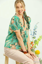 Umgee mixed abstract floral print green blouse with orange beige flowers, short puffed sleeves, and embroidered collar