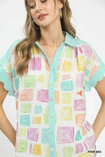 Umgee mixed media short-sleeved button-up collared top with colorful pastel geometric pattern on white background