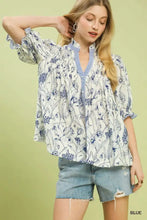 Blue and white floral print blouse with ruffled sleeves featuring mixed print button front by umgee